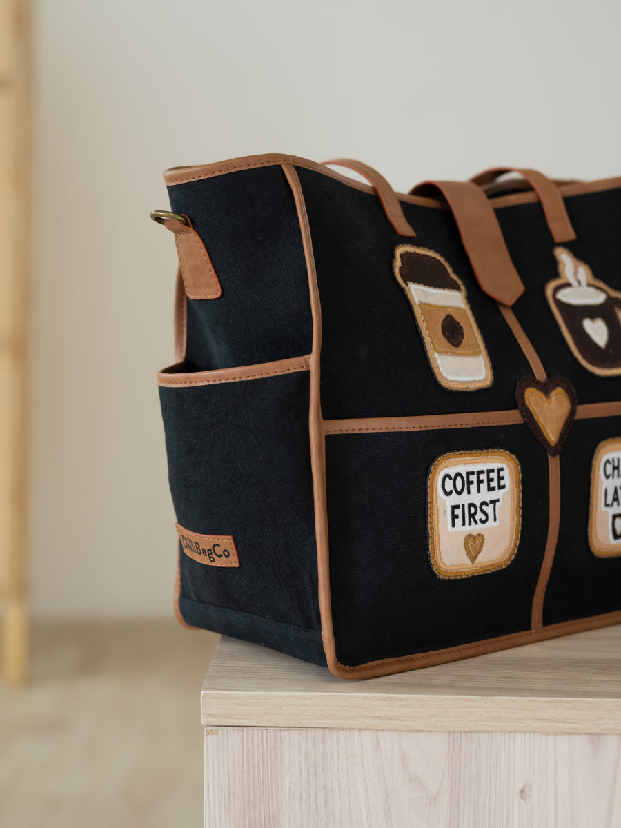 The Coffee Run Tote - Jet Black & Warm Tan - Lifestyle and styling perspective | DilliBagCo